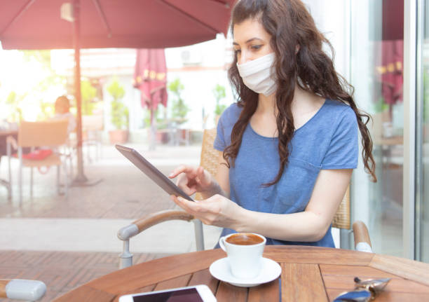 istock Woman with face protective mask 1250973740