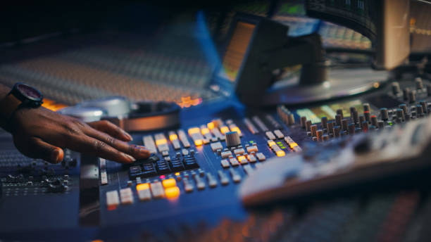 istock Close-up Shot of a Surface Control Desk Equalizer Mixer. Buttons, Faders, Sliders to Broadcast, Record, Play Hit Song. Artist Works in the Music Record Studio. 1250975203