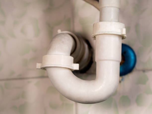 istock white bathroom drain pipe pipes and ceramic wall close-up 1250976917