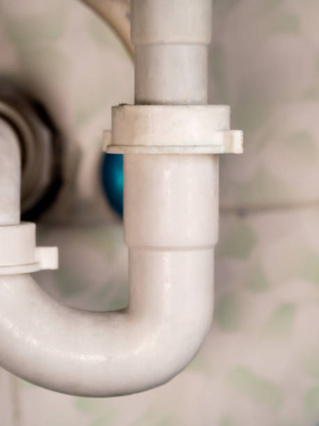 istock white bathroom drain pipe pipes and ceramic wall close-up 1250976977