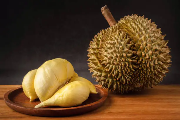 Photo of Durian, King of tropical fruits in Southeast Asia, Thailand. Popular fruit fresh dessert in Thailand served. Its fruit sweet, buttery in texture, very little juice. Durian has famously strong smell