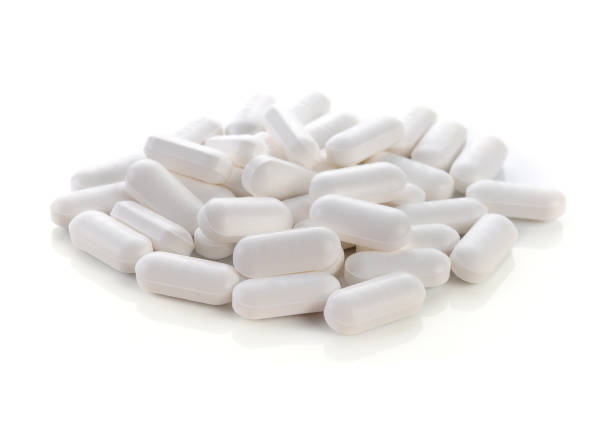 istock Medical pill tablet isolated on white. 1250982934