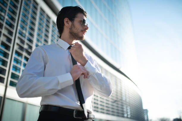 istock Businessman adjusting his shirt's cuff 1250983048
