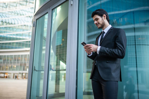 istock Businessman using an app on his phone 1250983296