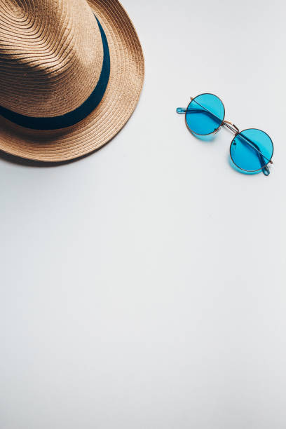 istock Summer hat on the head and blue sunglasses. 1250983442
