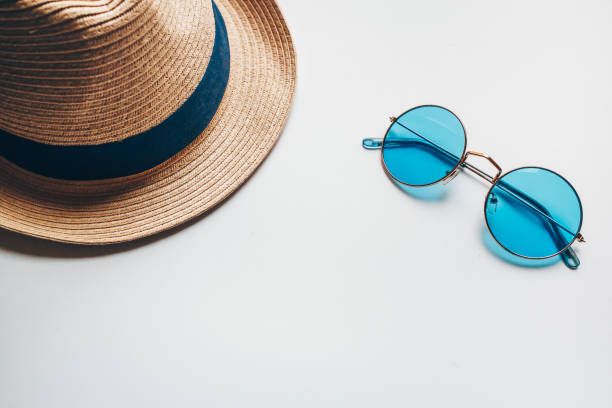 istock Summer hat on the head and blue sunglasses. 1250983443