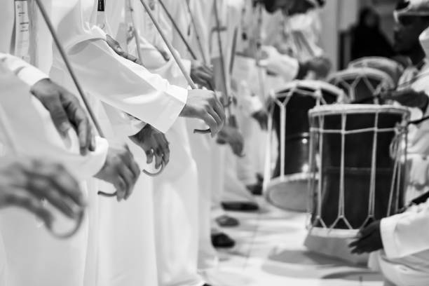 Group of emirati dancing traditional men dance in heritage festival Group of emirati dancing traditional men dance in heritage festival. High quality photo arabic drums stock pictures, royalty-free photos & images