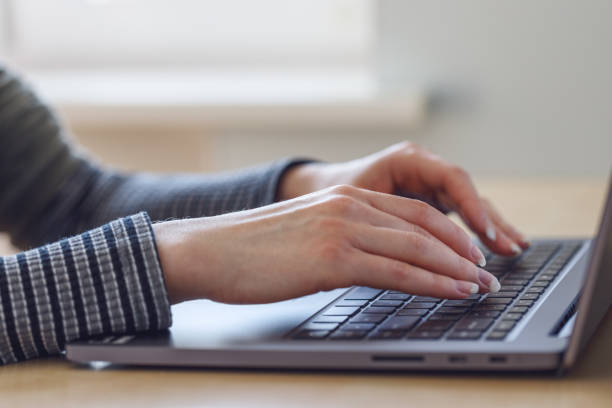 istock Woman using laptop indoor. 1250990892