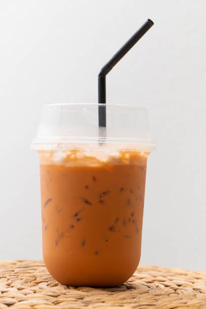 istock ice thai tea with milk in transparent plastic in white background with path 1250991070