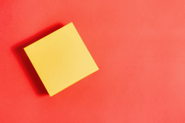 istock Color closed box on a creative background. Gift box for a holiday or parcel delivery. Concept of delivery of goods by mail. Top view, copy of the space. 1250993167