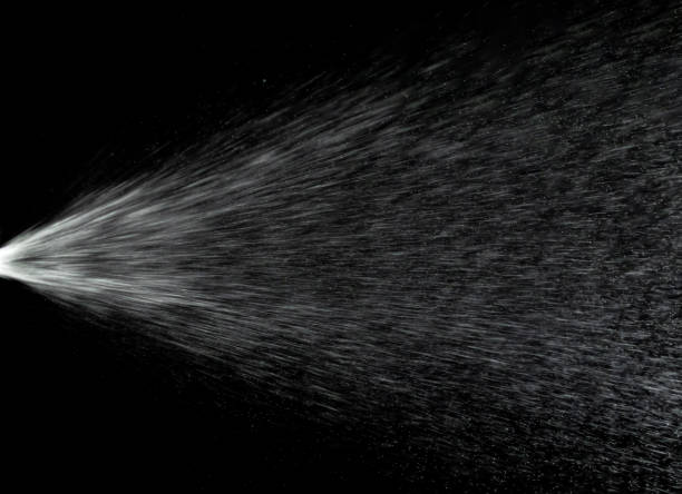 istock Water mist splash bottle isolated on black background. Spray liquid aerosol for perfume. 1250996785