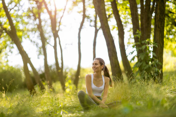 istock Young woman exercising in a park 1250997009