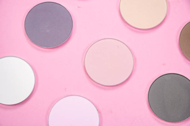 istock Pattern of eye shadows of different colors on a pink background 1250998076
