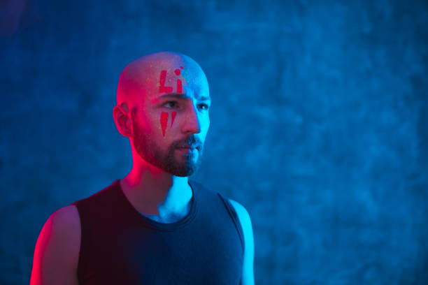 istock Portrait of man with unusual make up on face. 1250998196
