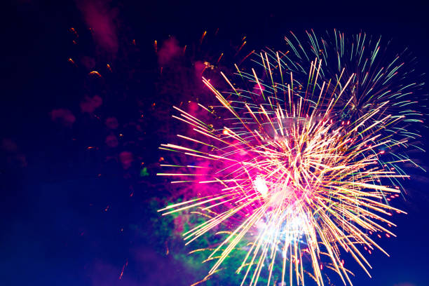 istock 4th July fireworks. Fireworks display on dark sky background 1250998450