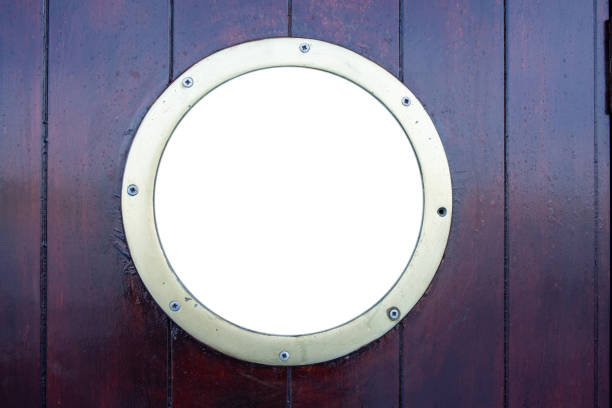 istock Ship porthole on brown wooden wall background, copy space 1251001167