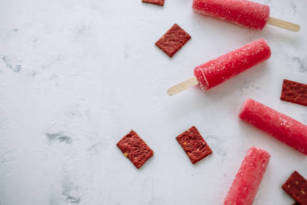istock Pink fruit ice sorbet on a white background. Stick ice cream. Flat lay 1251001716