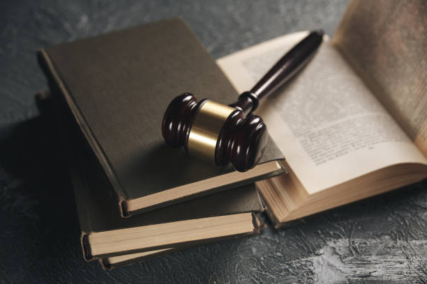 istock Wooden gavel on the table with notary books. 1251002083