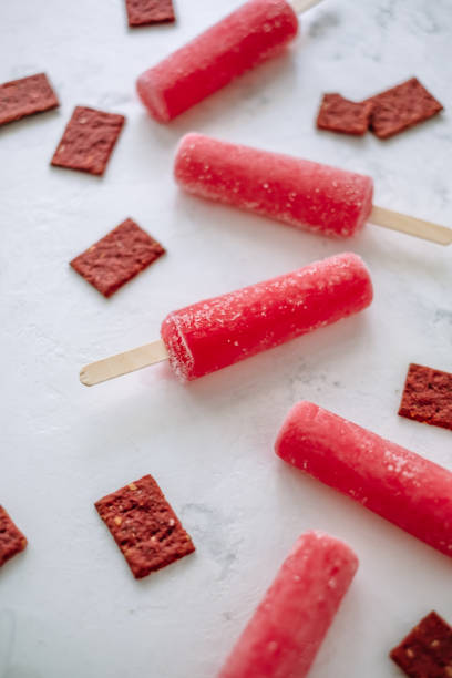 istock Pink fruit ice sorbet on a white background. Stick ice cream. Close up 1251003164