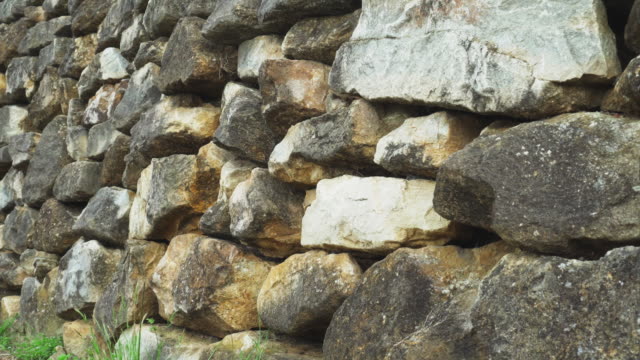 Stone wall made of natural hard stone.