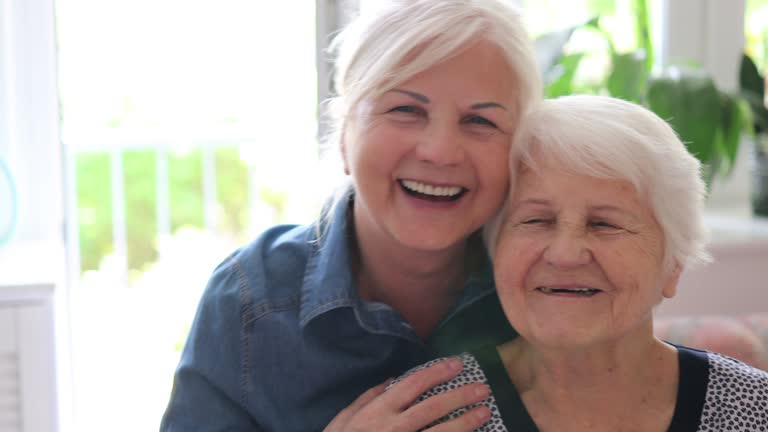 Senior Woman Enjoying a relaxing moment with her Daughter at Home