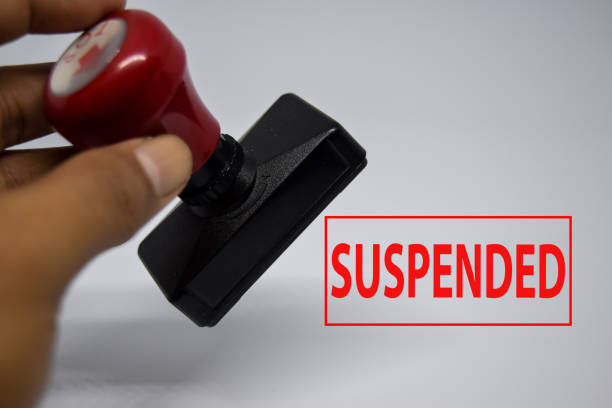 istock Close up Red Handle Rubber Stamper and text suspended isolated on White Background. 1251004136