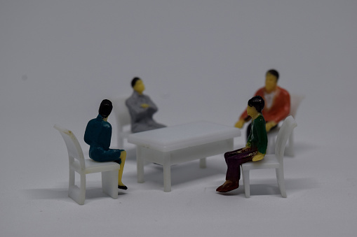 Close up model toy/miniature people talking business. business concept