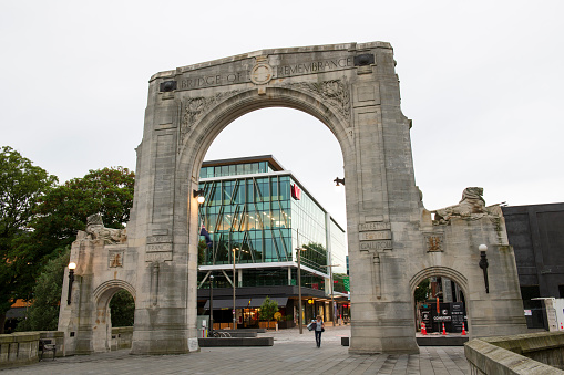 Christchurch, New Zealand - December 18, 2018. A lady walking under the arch of Bridge of Remembrance in downtown Christchurch, South Island, New Zealand
