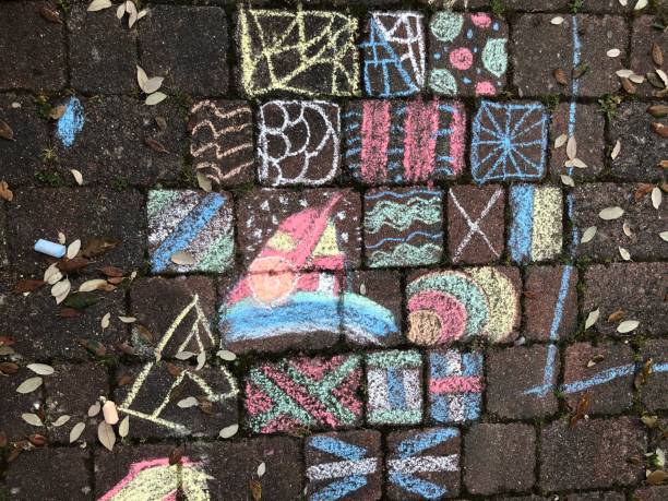 istock Colourful chalk drawings on the cobblestones 1251005202
