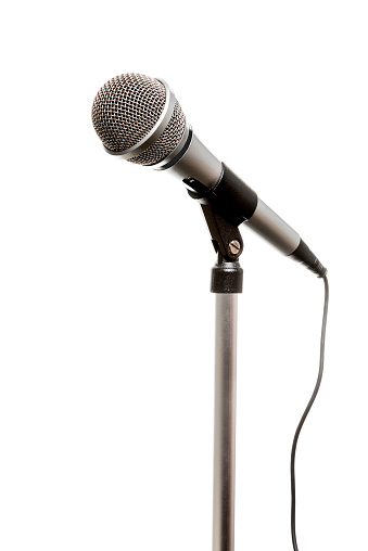 Chrome microphone seen from an angle isolated on a white background