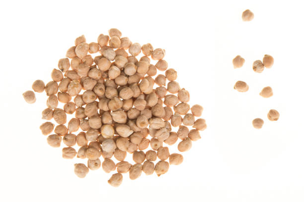 istock Pile of chick peas seen from above isolated on a white background 1251006145