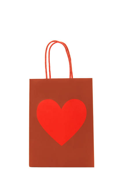 istock Red gift bag with a heart on it isolated on a white background 1251006174