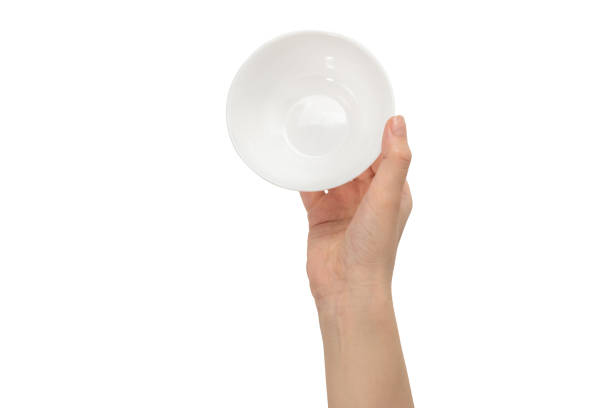 istock White bowl in woman hand isolated on white. 1251007329