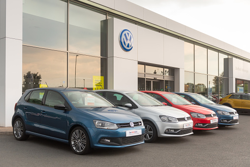Staffordshire, England - 16 June 2020: A row of Volkswagen Polo cars for sale at a Volkswagen dealership.