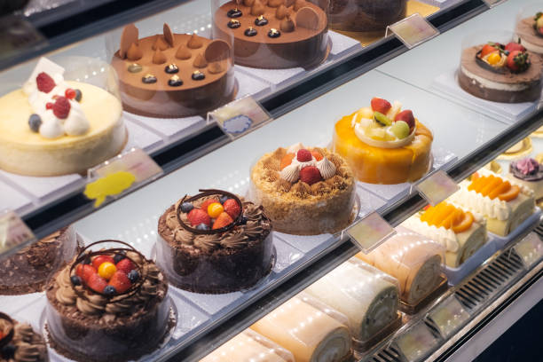 istock sweets and cakes on display in bakery shop - 1251014091