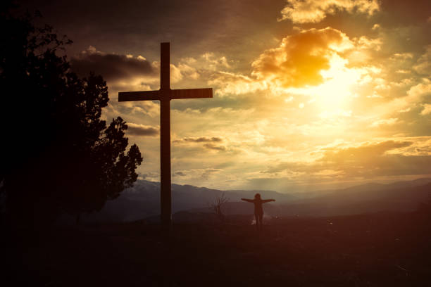 istock woman with cross 1251015205
