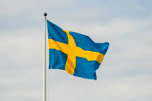 istock Large swedish flag waving in the breeze. 1251015283