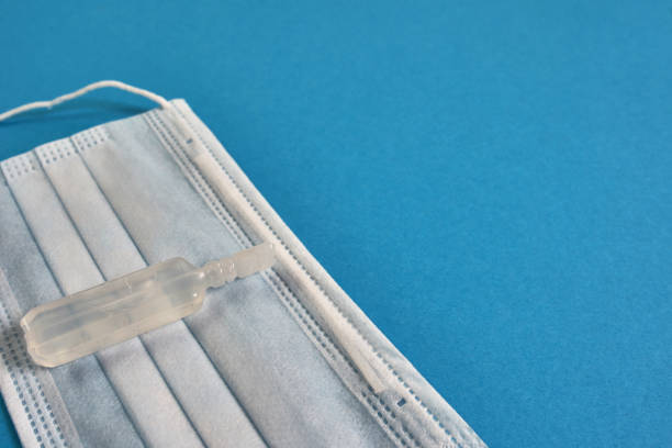 istock Virus protection mask on a blue background. 1251020449