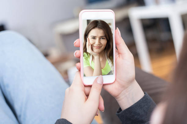 istock young woman holding a mobile phone 1251022853