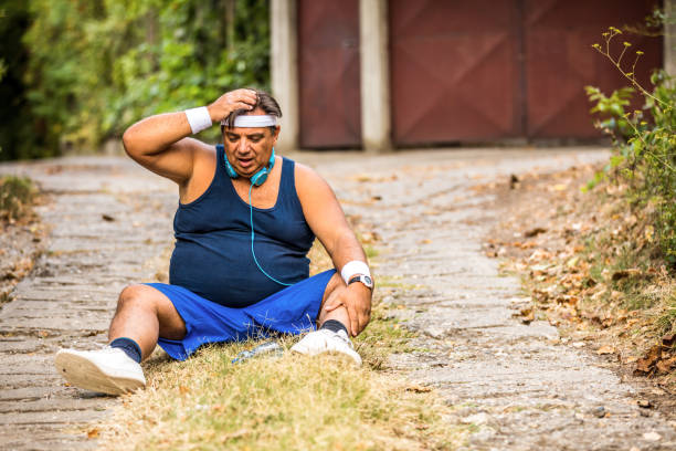 istock Overweight man feels side aches after intense workouts outdoors, health problems 1251028226