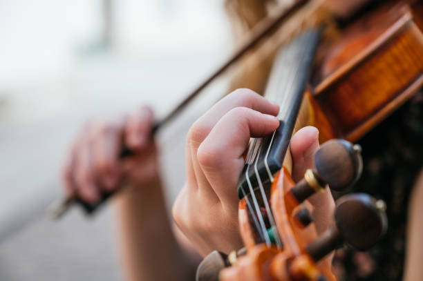 istock Violin close-up, woman playing the violin. 1251031621