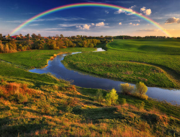 istock Landscape with a Rainbow on the River in Spring 1251031633