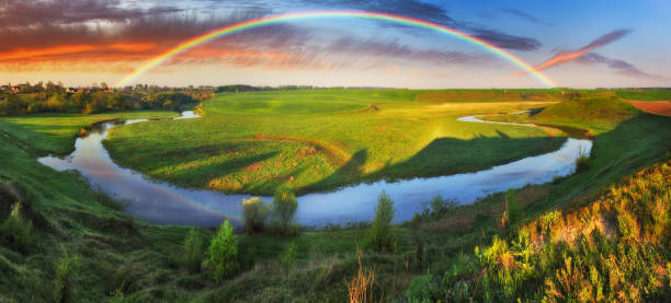 istock Landscape with a Rainbow on the River in Spring 1251031639