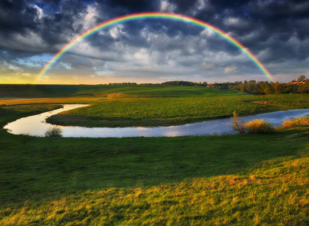 istock Landscape with a Rainbow on the River in Spring 1251031668