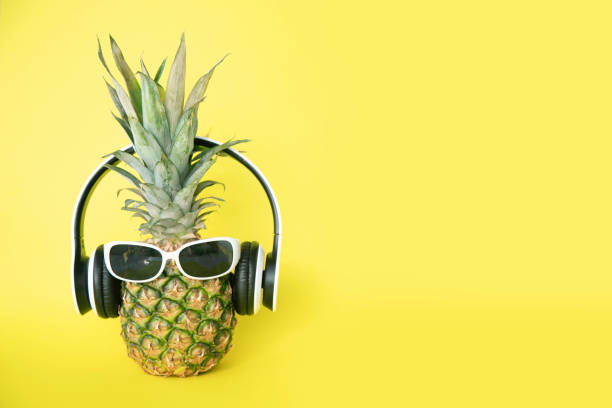 istock Pineapple with headphones and sunglasses 1251033625