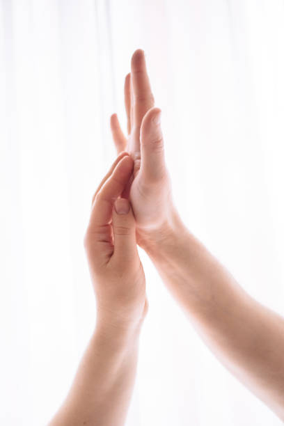 istock male and female hand 1251035245