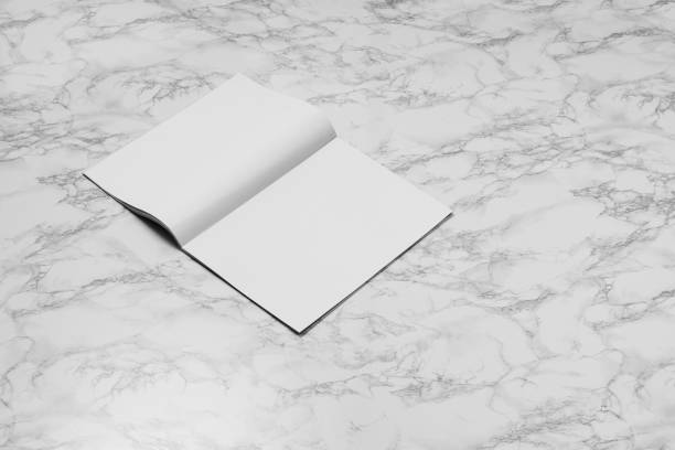 istock Mock-up magazine, newspaper or catalog isolated on white marble background. 1251036984