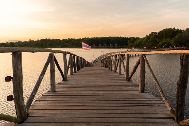 istock wooden bridge over a lake 1251037755
