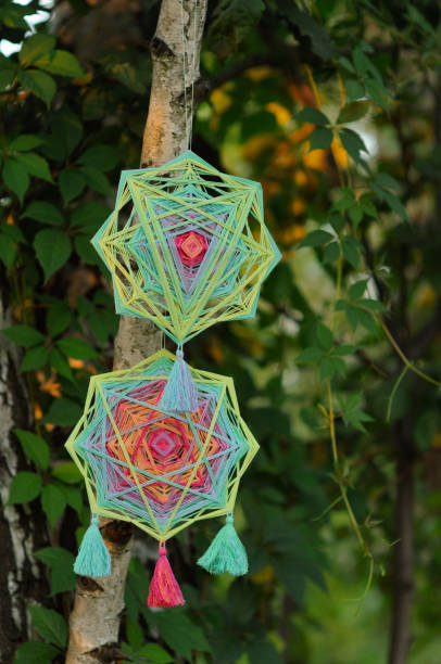 istock Woven bright handmade yarn mandala outdoors in park 1251039146
