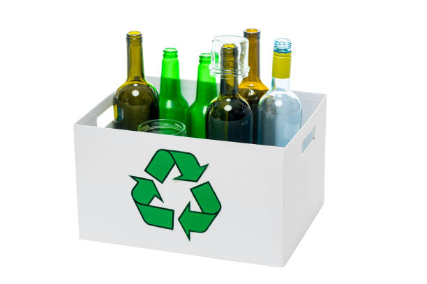 istock Glass bottles inside a glass recycling container 1251044619